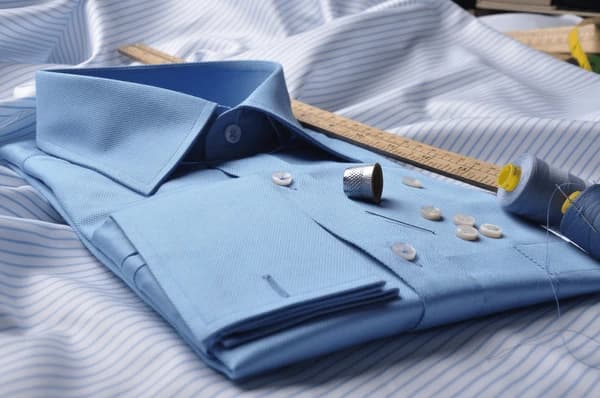 https://backend.antailors.ae/wp-content/uploads/2025/05/tailored-bespoke-shirt-close-600nw-1386019901.webp